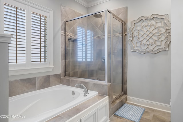 bathroom with tile patterned flooring, ornamental molding, plus walk in shower, and a healthy amount of sunlight