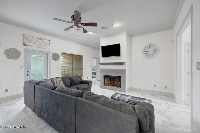 living room featuring ceiling fan and ornamental molding