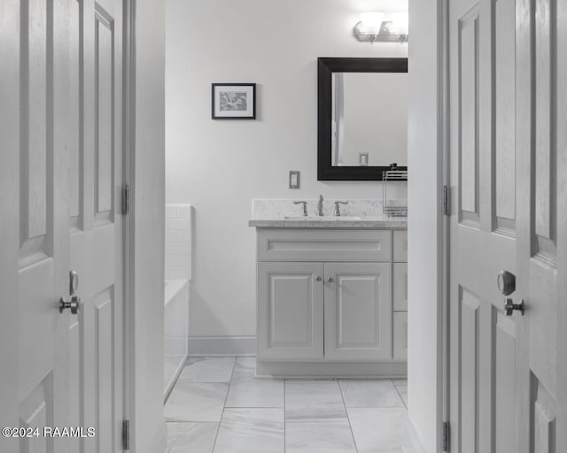 bathroom with a bathtub and vanity