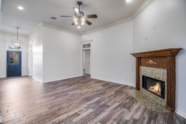 unfurnished living room with crown molding, hardwood / wood-style floors, ceiling fan with notable chandelier, and a high end fireplace