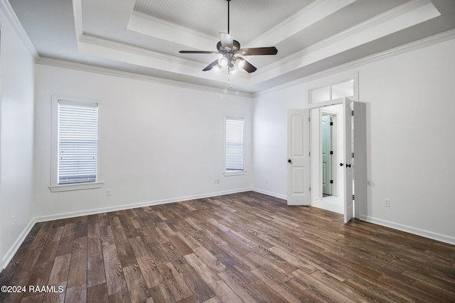 unfurnished room with crown molding, dark hardwood / wood-style flooring, and a wealth of natural light