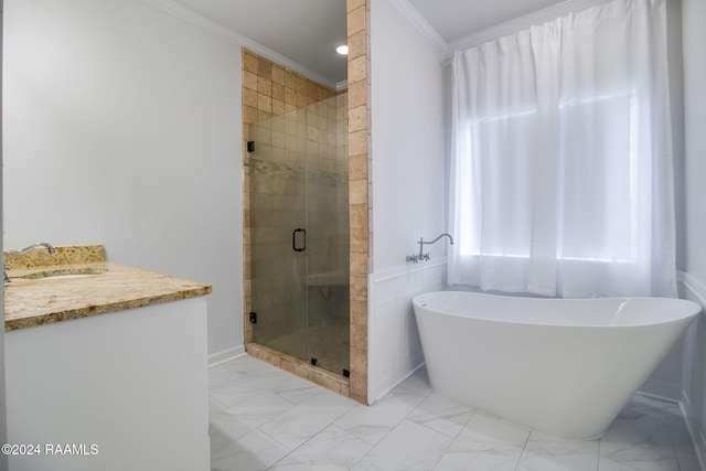 bathroom featuring vanity, ornamental molding, and shower with separate bathtub