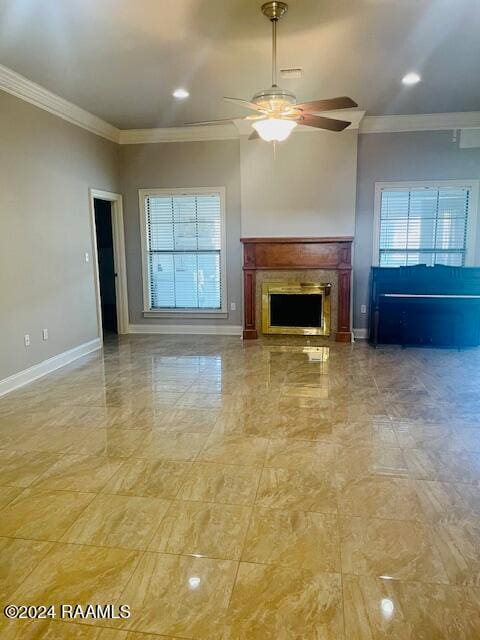 unfurnished living room with ornamental molding and ceiling fan