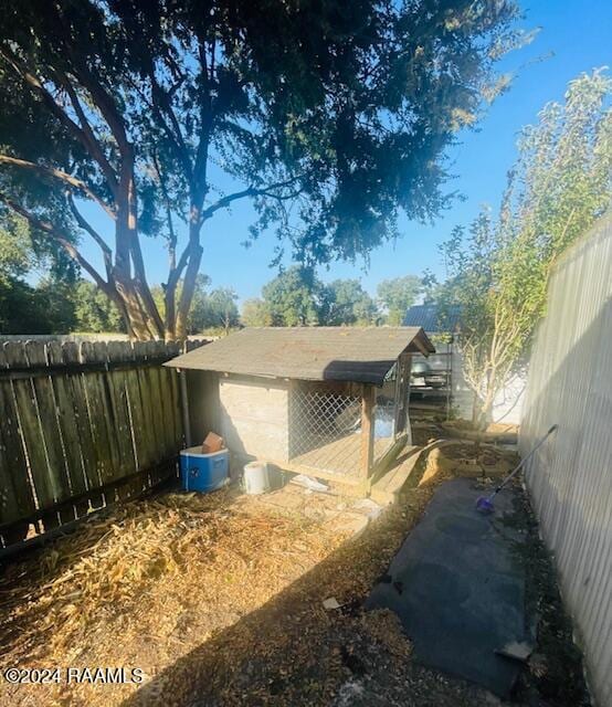 view of side of property with an outdoor structure