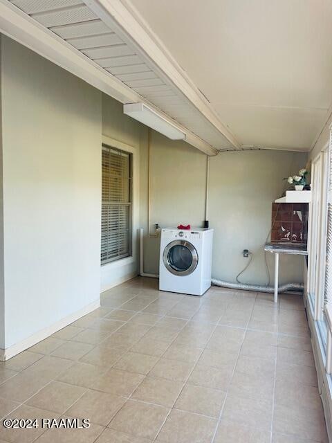 washroom featuring light tile patterned floors and washer / clothes dryer