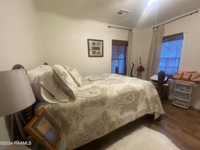 bedroom featuring dark hardwood / wood-style flooring