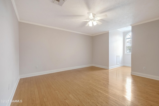 empty room featuring ceiling fan, crown molding, a textured ceiling, and light hardwood / wood-style floors