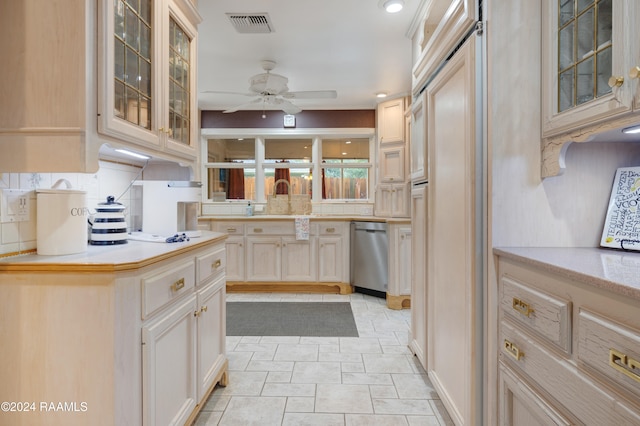 kitchen with dishwasher, tasteful backsplash, sink, and ceiling fan