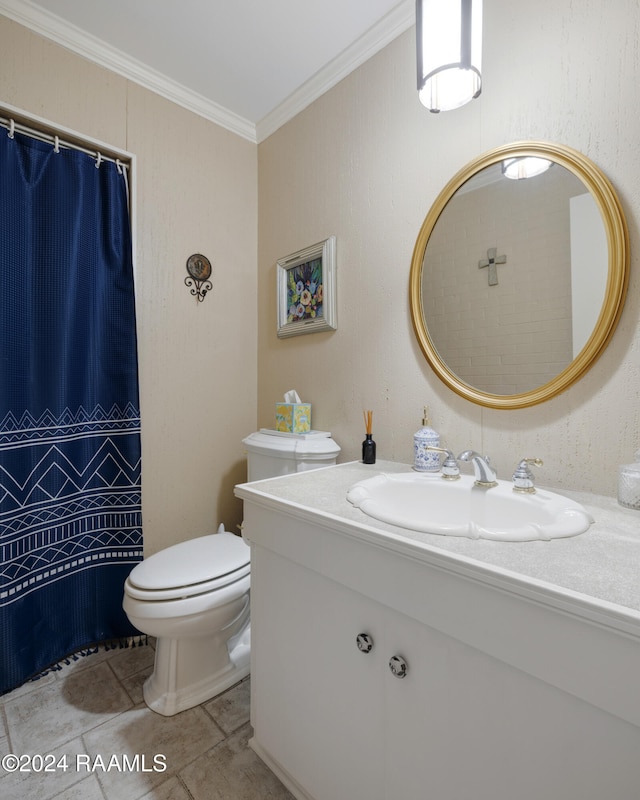 bathroom with toilet, vanity, tile patterned flooring, and ornamental molding