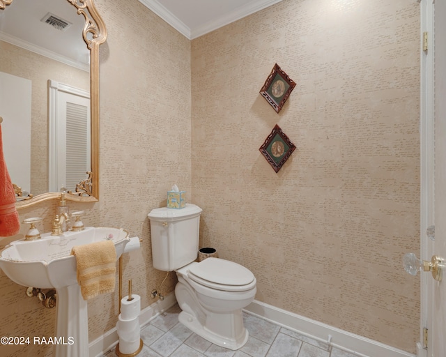 bathroom featuring toilet, tile patterned flooring, and ornamental molding