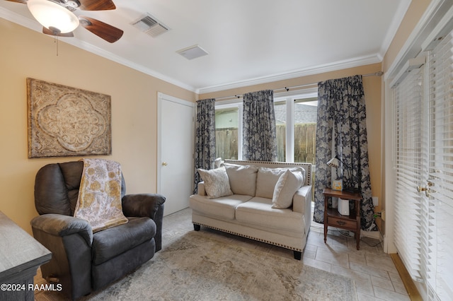 living room featuring ceiling fan and ornamental molding