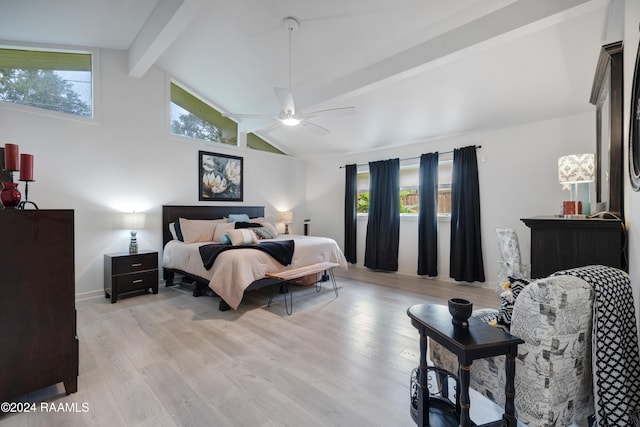 bedroom with ceiling fan, multiple windows, light wood-type flooring, and lofted ceiling with beams