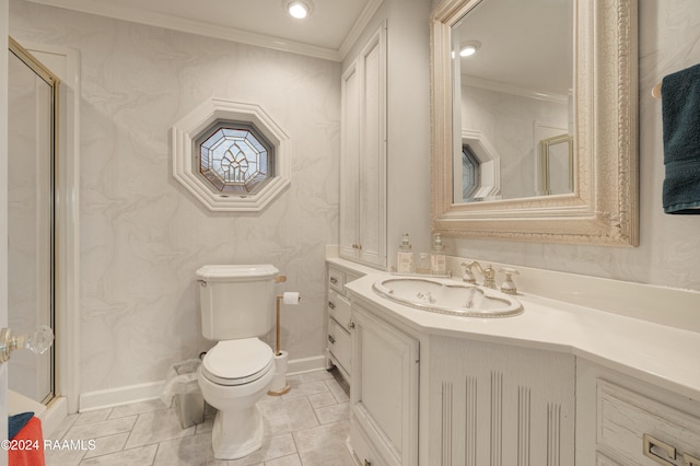 bathroom with a shower with shower door, vanity, toilet, and crown molding