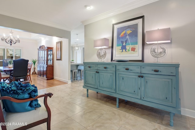 hall with crown molding, an inviting chandelier, and light tile patterned floors