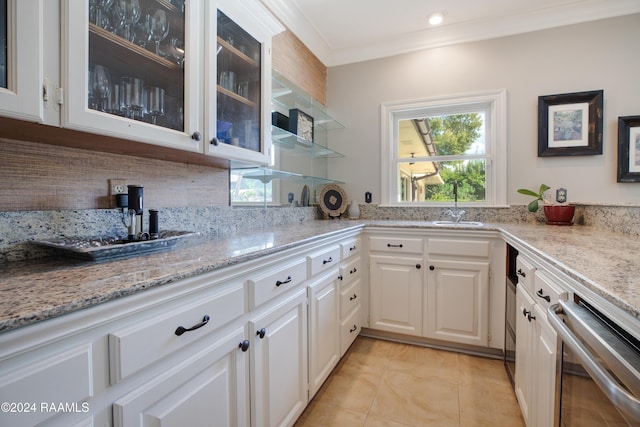 402 Old Settlement Rd, Lafayette, LA 70508 - kitchen with a sink, dishwasher, white cabinets, light stone counters, and crown molding