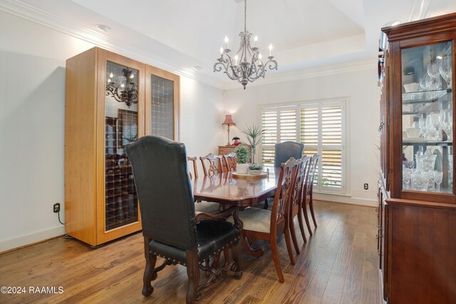 402 Old Settlement Rd, Lafayette, LA 70508 - dining area featuring a chandelier, light wood-type flooring, baseboards, and crown molding