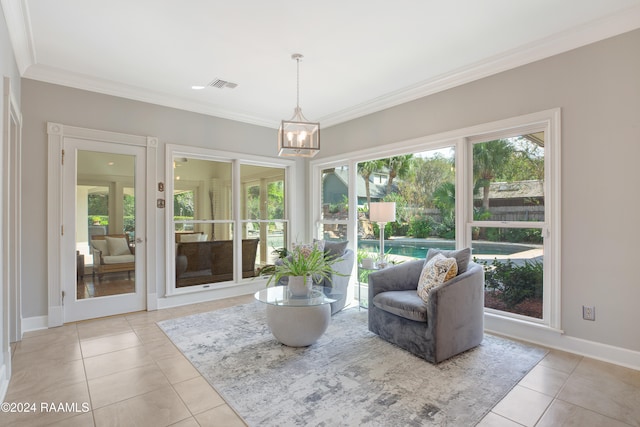 interior space featuring an inviting chandelier, crown molding, and light tile patterned floors