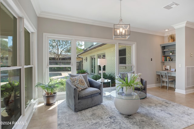 tiled living room featuring crown molding and a notable chandelier