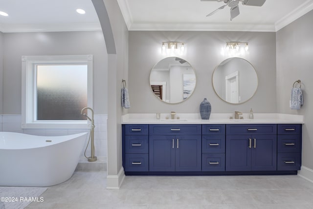 402 Old Settlement Rd, Lafayette, LA 70508 - full bath with a ceiling fan, a freestanding tub, double vanity, crown molding, and tile patterned flooring