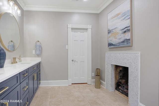 402 Old Settlement Rd, Lafayette, LA 70508 - bathroom featuring ornamental molding, double vanity, tile patterned flooring, a tile fireplace, and baseboards