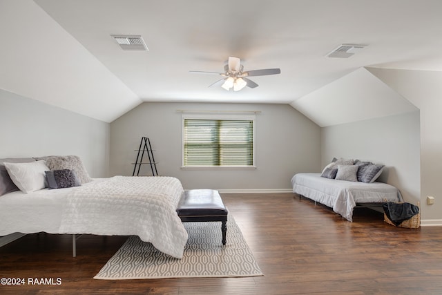 bedroom with lofted ceiling, dark hardwood / wood-style floors, and ceiling fan