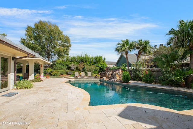 view of swimming pool featuring a patio area