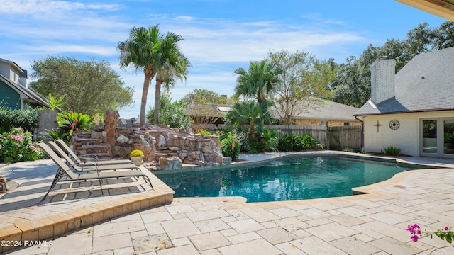 view of swimming pool with a patio