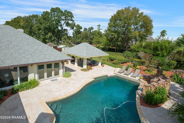 402 Old Settlement Rd, Lafayette, LA 70508 - swimming pool with a patio, a storage structure, an outbuilding, and french doors