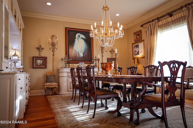 dining room with dark wood-type flooring, a chandelier, recessed lighting, ornamental molding, and baseboards