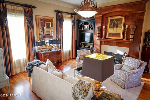 living room with wood finished floors and a fireplace