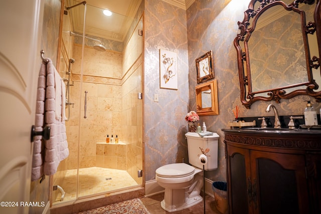 bathroom featuring a shower with shower door, toilet, tile patterned floors, vanity, and crown molding