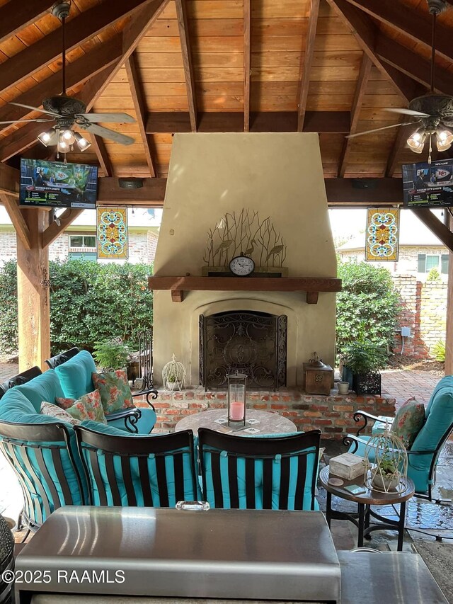 303 Sawgrass Ln, Broussard, LA 70518 - view of patio featuring ceiling fan, an outdoor living space with a fireplace, a gazebo, and outdoor dining space
