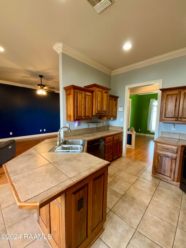 kitchen with tile countertops, black dishwasher, ornamental molding, light tile patterned floors, and ceiling fan