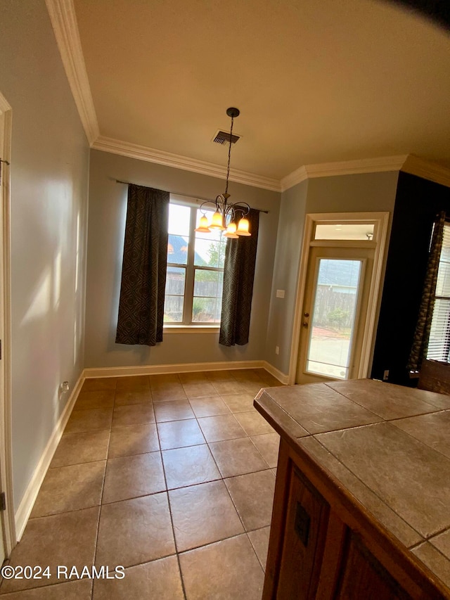 unfurnished dining area featuring a notable chandelier, ornamental molding, and light tile patterned flooring