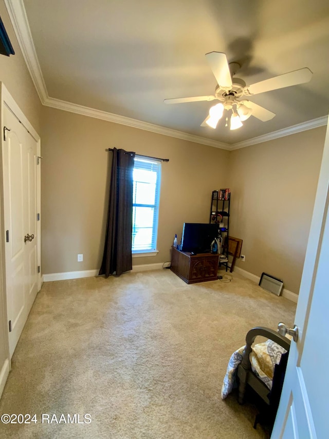 misc room featuring ornamental molding, light carpet, and ceiling fan