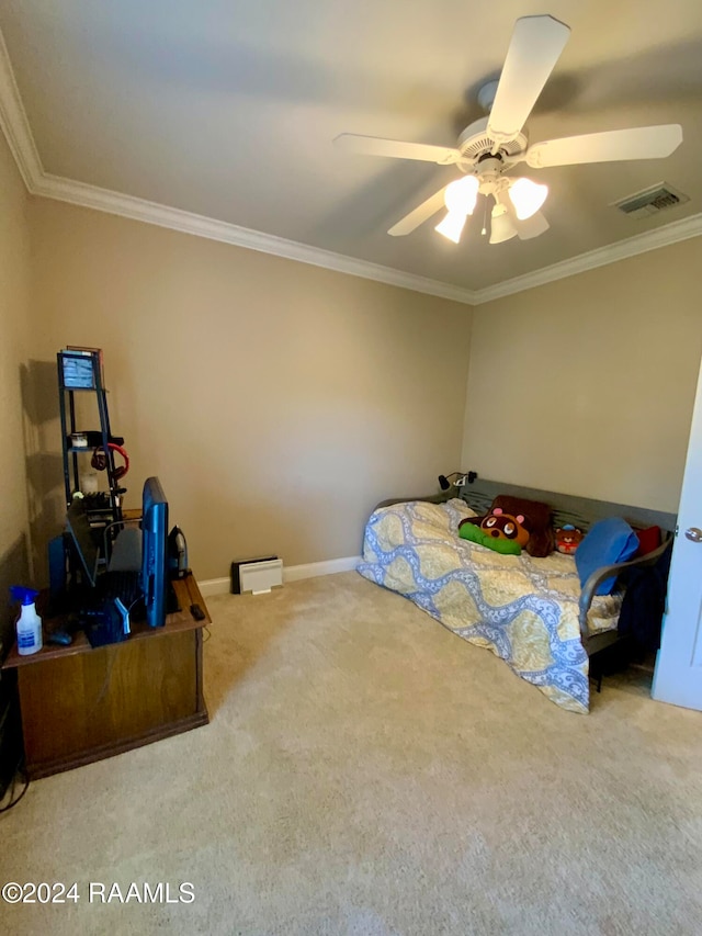 carpeted bedroom with ceiling fan and crown molding