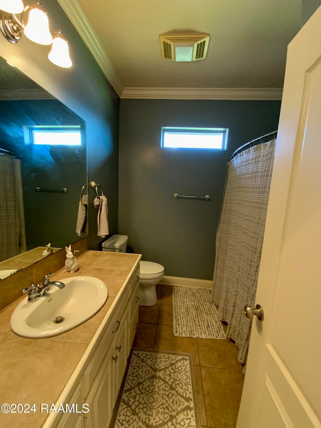 bathroom featuring vanity, ornamental molding, toilet, and tile patterned floors