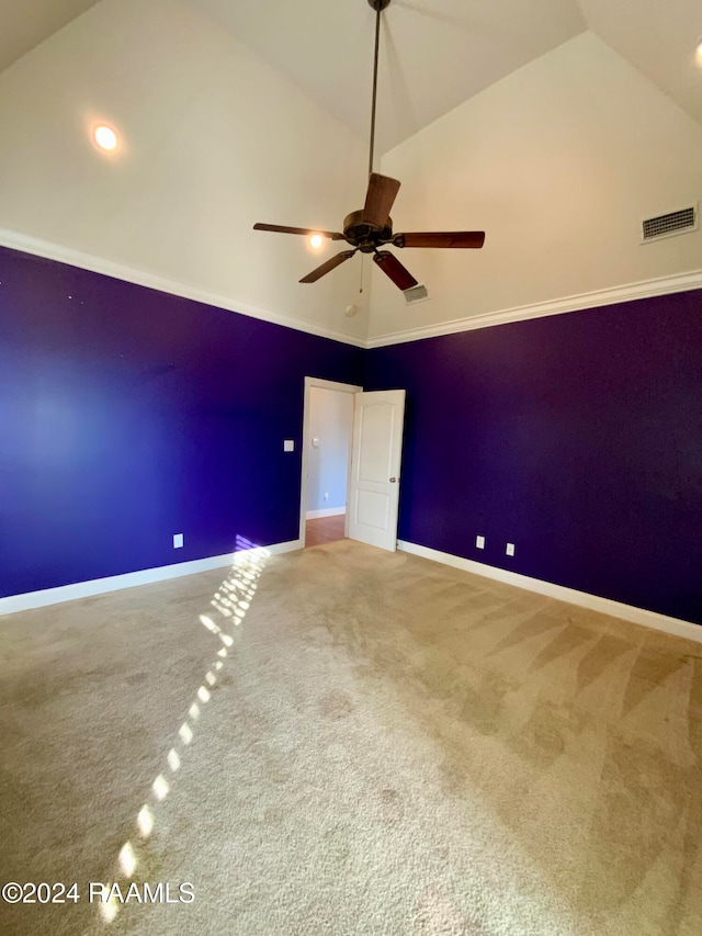 unfurnished bedroom with ceiling fan, high vaulted ceiling, carpet floors, and crown molding