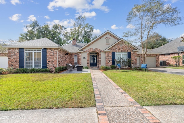 view of front facade with a front yard and a garage