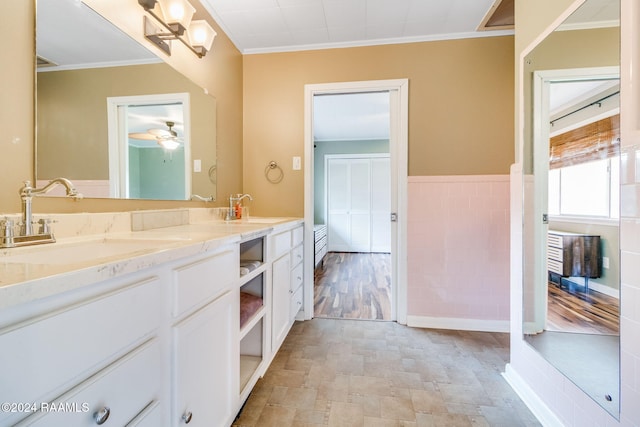 bathroom featuring vanity and crown molding