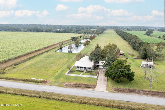 birds eye view of property featuring a water view and a rural view