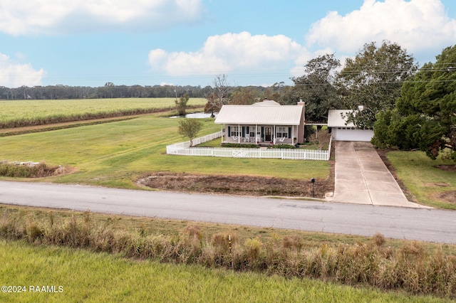 birds eye view of property with a rural view