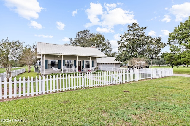 single story home with a garage, a front lawn, and covered porch