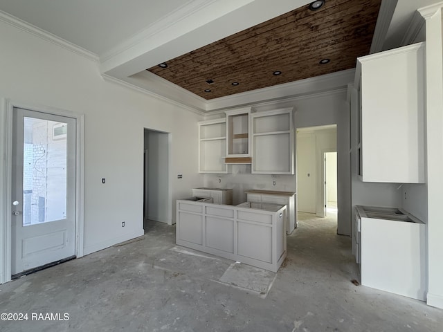 kitchen with white cabinetry and ornamental molding