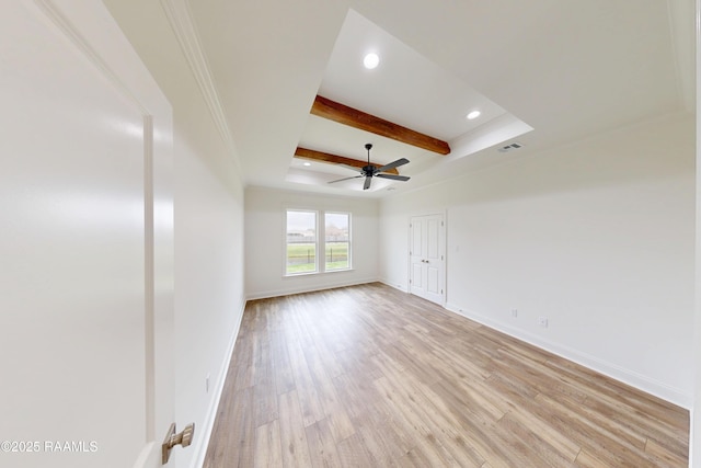 empty room with recessed lighting, light wood-style floors, a ceiling fan, beamed ceiling, and baseboards