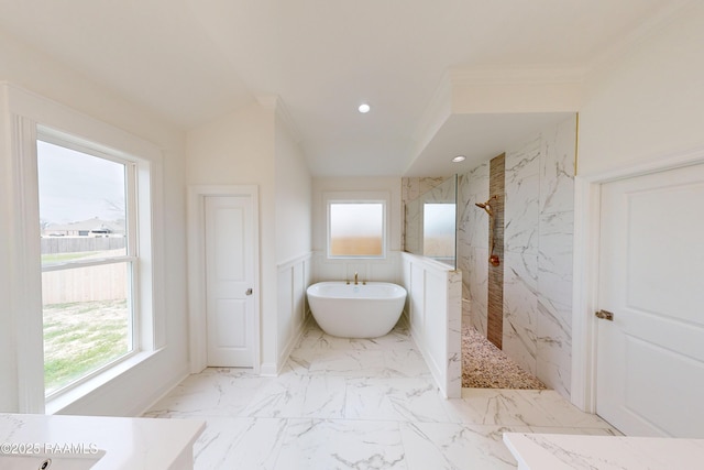 full bathroom featuring a freestanding tub, marble finish floor, plenty of natural light, and a marble finish shower