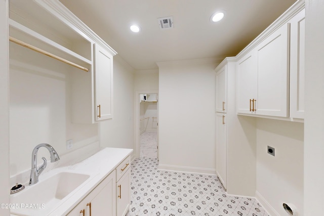 laundry area with visible vents, a sink, electric dryer hookup, and recessed lighting