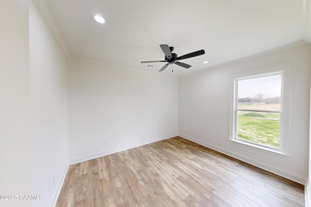 unfurnished room with crown molding, recessed lighting, light wood-type flooring, and baseboards