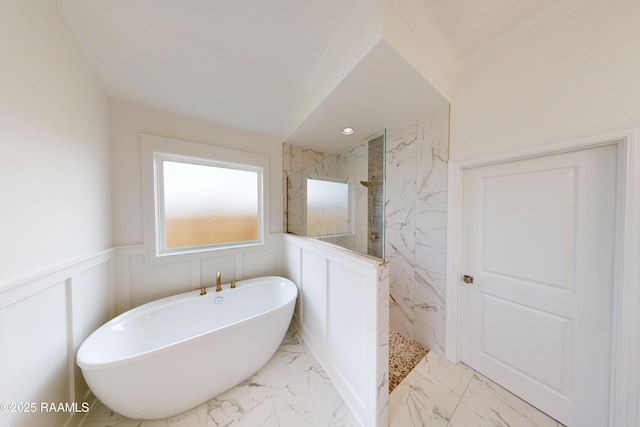 full bathroom with a freestanding tub, a decorative wall, marble finish floor, wainscoting, and a marble finish shower