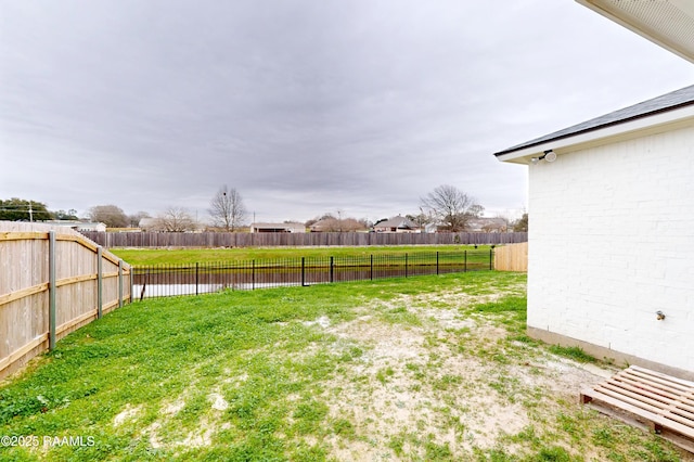 view of yard featuring a fenced backyard